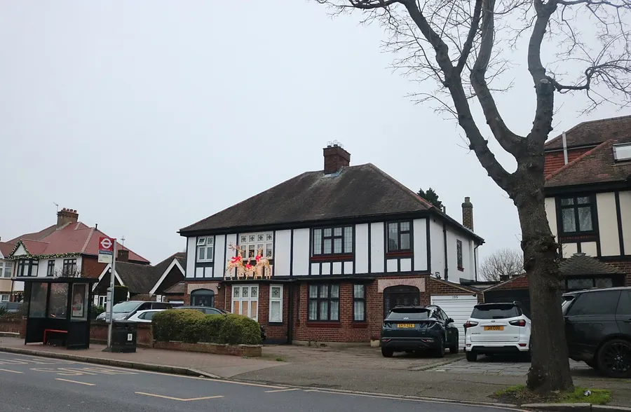 Mock Tudor 1930s semi-detached houses on Corbets Tey Road in Upminster with cars parked in front and side drives